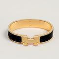 BRACELET HERMES CLIC H NOIR DOREE