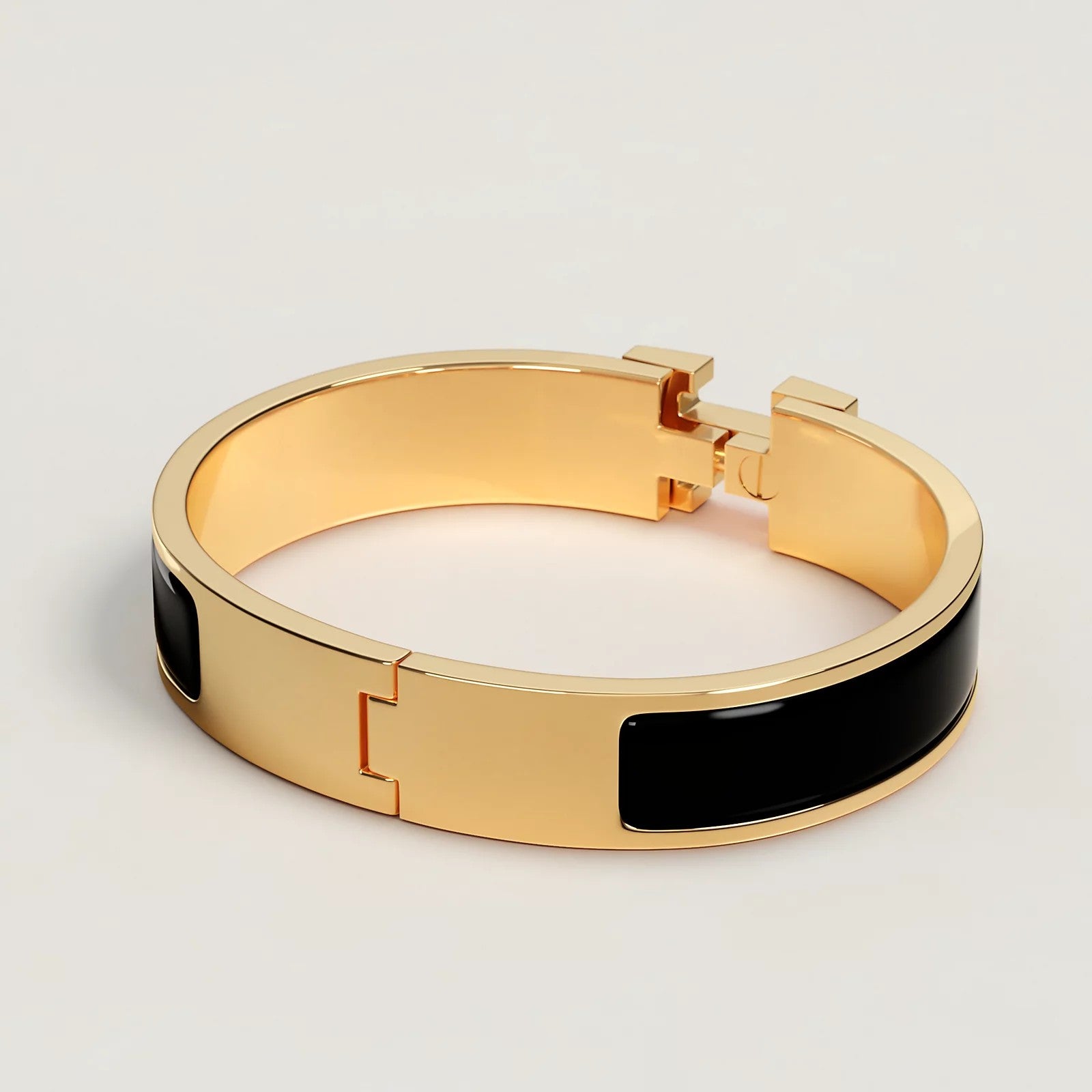 BRACELET HERMES CLIC H NOIR DOREE