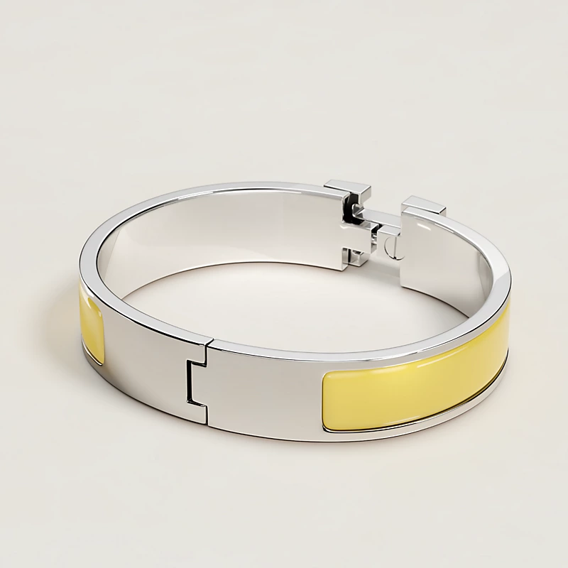 BRACELET HERMES CLIC H JAUNE D'OR ARGENTE